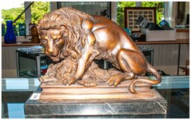 A Cast Bronze Lion On a Marble Base depicting a family kill. After The Antique.