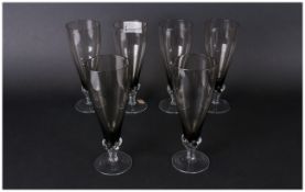 Set Of Six Bohemian Coloured Crystal Glass Champagne Flutes with a moulded stem with original label,