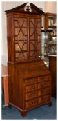 A Reproduction Mahogany Inlaid Georgian Style Bureau Bookcase of small size.