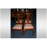 A Set of Four Beech Walunt Stained Chippendale Style Chairs.