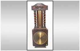 1920's Solid Oak Cased Barometer/Thermometer with barley twist columns. 27" in height.