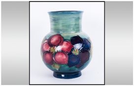 Moorcroft Globular Shaped Vase 'Clematis' Pattern On Green/Blue Ground. Circa 1950's.