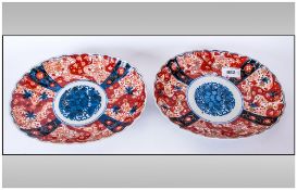 Pair Of Fluted Oval Imari Dishes with typical imari palette. 8x5''. Late Meiji Period.