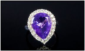 Amethyst and Peridot Pear Cut Ring, the single pear cut purple amethyst, measuring 6.15cts, of