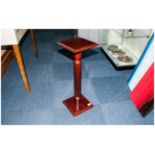A Small Mahogany Plant Pot Pedestal in the Regency Style.
