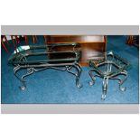 Two Wrought Iron Coffee Tables with shaped square glass top on shaped cabriole legs.