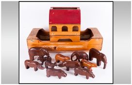 A Vintage Handmade Wooden Model Of Noahs Ark, complete with 10 hand carved animal figures.