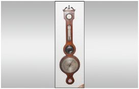 A Georgian Mahogany Banjo Shaped Barometer with a silvered dial and a thermometer in a silvered