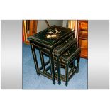 A Nest Of Four Black Lacquered & Decorated Chinese Tables.