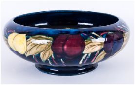 Moorcroft 'Plum and Wisteria' Pattern Bowl, with inverted rim and low foot, a band of purple,