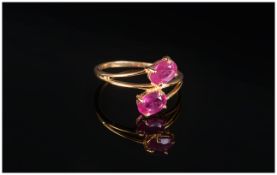 Ruby Crossover Ring, two oval cut rubies, totalling 2.5cts, set in 14ct gold vermeil and silver,