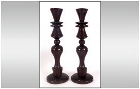 Pair Of Antique Treen Turned Wood Candlesticks On Round Bases, with baluster shaped central