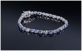 Tanzanite and White Topaz Tennis Bracelet, oval cut tanzanites, the gemstone found only in the