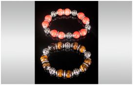 Set of Two Gemstone Bracelets, one of tiger eye round beads with openwork caps and spacers, the