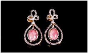 Rhodochrosite Pair of Drop Earrings, two oval cut cabochons of the unusual semi-precious, rose