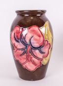 Moorcroft Vase 'Hibiscus' Design on Chocolate brown ground. 4.25'' in height. Excellent condition.