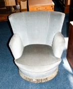 Art Deco Square Backed Bedroom Tub Chairs, Covered In a Blue Velvet Material, with a Fringed Bottom.