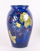 Moorcroft Small Vase 'Clematis' Design on blue ground. Moorcroft label to base. 4'' in height.