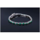 Emerald and White Topaz Tennis Bracelet, oval cut emeralds of good colour, interspaced with square