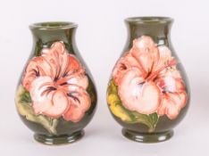 Moorcroft Pair Of Small Globular Shaped Vases 'Coral Hibiscus' Design On Green Ground, Each stands