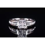 18ct White Gold Diamond Set Ring, The central four claw raised platform set diamonds with