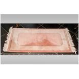 Small Rectangular Wool Rug, predominantly pale pink in colour with beige border. 140x70cm