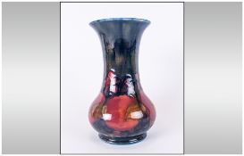 Moorcroft 'Pomegranate and Berries' Pattern Baluster Vase, traditional autumnal colours on a deep