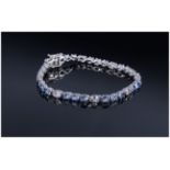 Tanzanite and White Topaz Tennis Bracelet, oval cut tanzanites, the gemstone found only in the