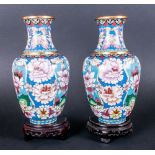 Chinese Fine Early 20th Century Pair Of Cloisonne Vases raised on lacquered ornate carved stands.