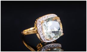 Green Amethyst and White Topaz Ring, a solitaire, cushion cut green amethyst of 6.45cts, with good