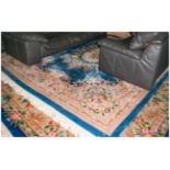 Large Pale Blue Ground Chinese Embossed Carpet with the central medallion picked out in Ivory with