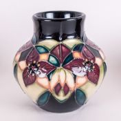 Moorcroft Tubelined Small Globular Shaped Vase 'Trillium' Design. Stylized floral design, painters