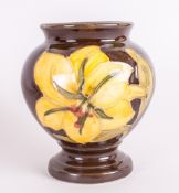 Moorcroft Small Vase 'Bermuda Lily' Design on Chocolate Ground. 3.25'' in height. Excellent