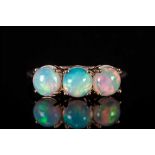 Opal Three Stone Ring, three round cut cabochon opals, with an excellent display of colours, each of