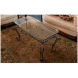 Continental Wrought Iron Coffee Table In The French Style with shaped legs & glass top. 20x40'' 20''