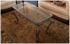 Continental Wrought Iron Coffee Table In The French Style with shaped legs & glass top. 20x40'' 20''