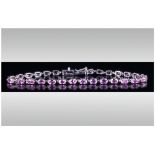 Pink Sapphire Tennis Bracelet, a row of oval cut, rare, pink sapphires, totalling 7cts, set in