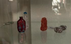 Four 20th Century Glass Chinese Snuff Bottles, two cameo cut, two coloured glass. Missing