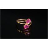 Ruby Crossover Ring, two oval cut rubies, totalling 2.5cts, set in 14ct gold vermeil and silver,