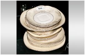 Twentytwo Assorted Pieces of Midwinter Lemon Band Dinnerware