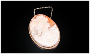 A Fine Quality Shell Cameo Brooch, Oval Shaped set in a 9ct gold mount. Hallmark London 1970.