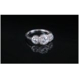 Swarovski Zirconia Trilogy Ring, comprising three round cut clear white stones, framed with small