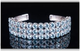 Sky Blue Topaz Three Row Bangle, 26cts of round cut sky blue topaz, reminiscent of aquamarine, set