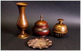 Four Pieces Of Islamic Engraved And Enamelled Brass Items, bell, lidded jar, vase & brass dish.