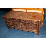 Antique Oak Coffer with a Lift up Lid, To The Front Carved with a Geometric Floral Design In Three