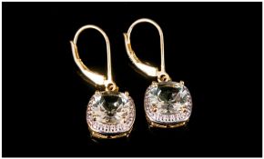 Sky Blue Topaz Pair of Drop Earrings, each comprising three round cut 1ct topaz, in a vertical drop,