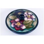 Moorcroft 'Clematis' Pattern Powder Bowl, the cover decorated with three clematis flowers of pink,