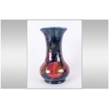 Moorcroft 'Pomegranate and Berries' Pattern Baluster Vase, traditional autumnal colours on a deep