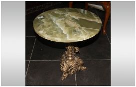 Onyx Top Coffee Table with a French gilded brass base. In the Ecclesiastical style. With enamel