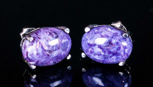 Russian Charoite Pair of Stud Earrings, each earring comprising a solitaire oval cut cabochon of the